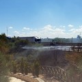 Auto in fiamme sulla SS16 bis: incendio propagato anche al  "Baden Powell "