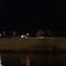 Scooter tra le persone sul molo di Cala Sant'Andrea a Molfetta
